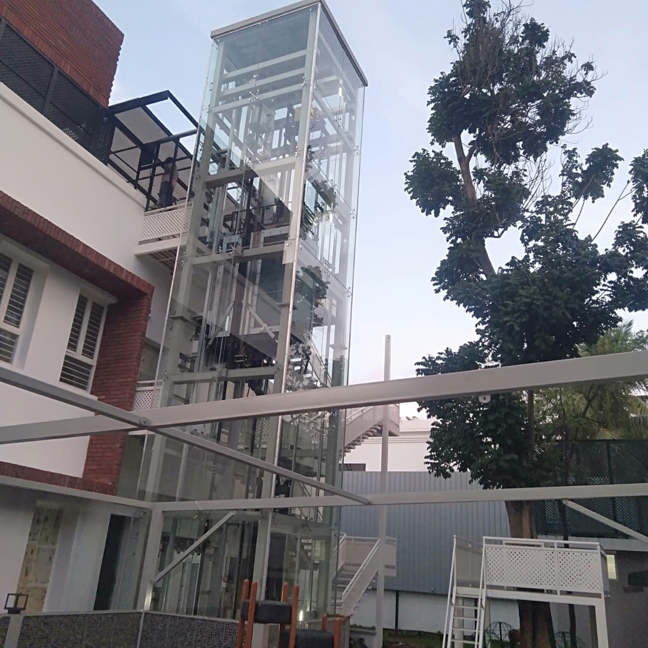 Exterior glass structure beside a building